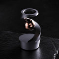 Gyroscope cinétique de bureau : structure spiralée noire et bille cuivrée