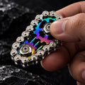Spinner chaîne de vélo : multicolore tenu en main